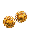 Golden clip-on earrings by Yves Saint Laurent