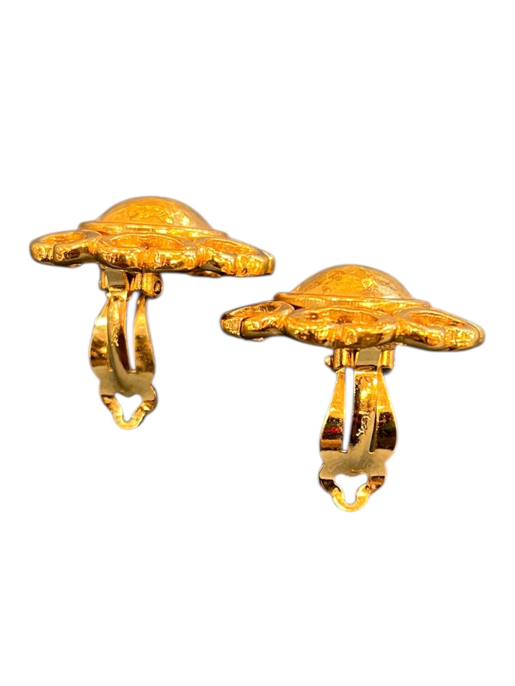 Golden clip-on earrings by Yves Saint Laurent