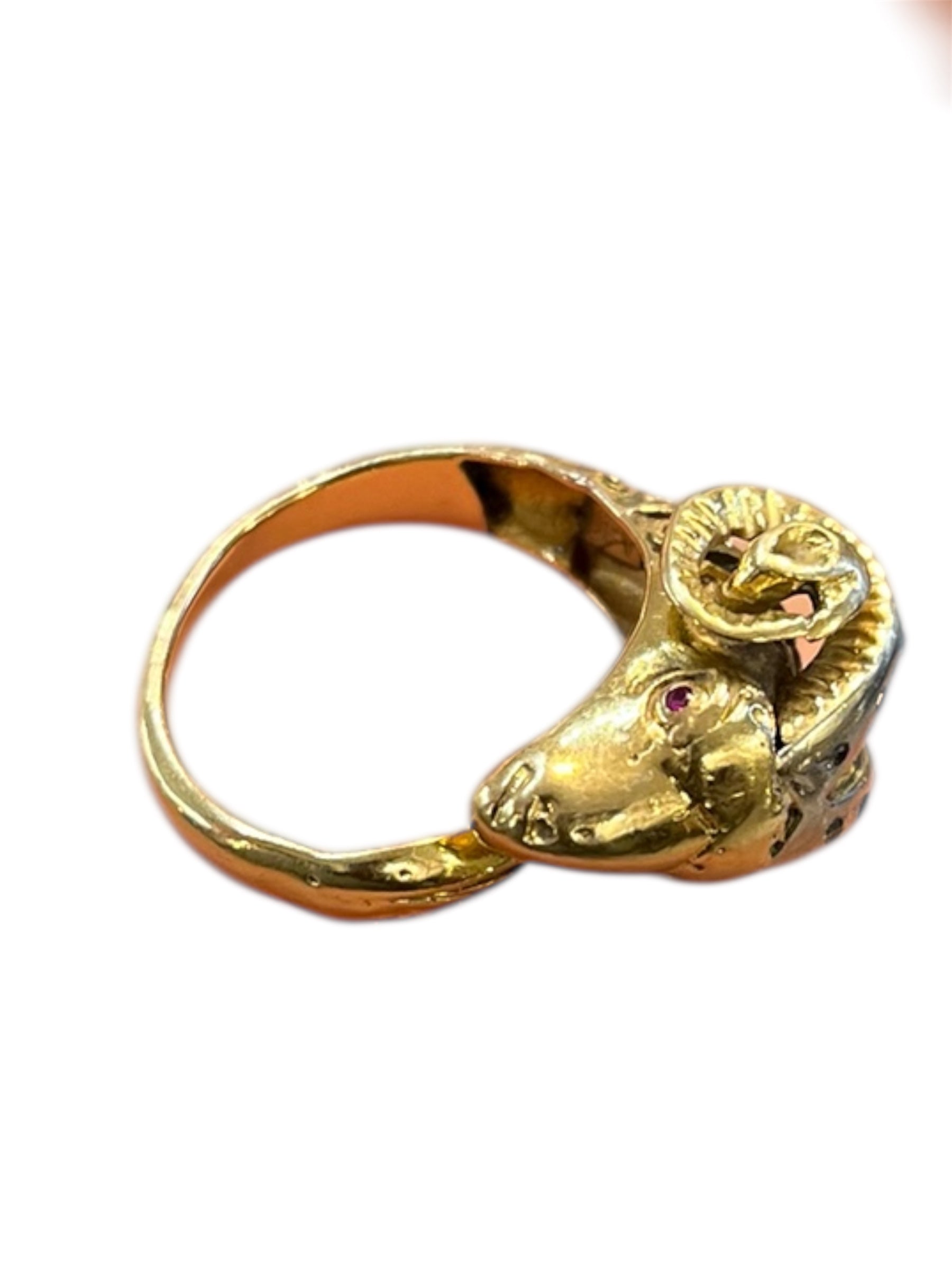 Open-band ring featuring a striking ram's