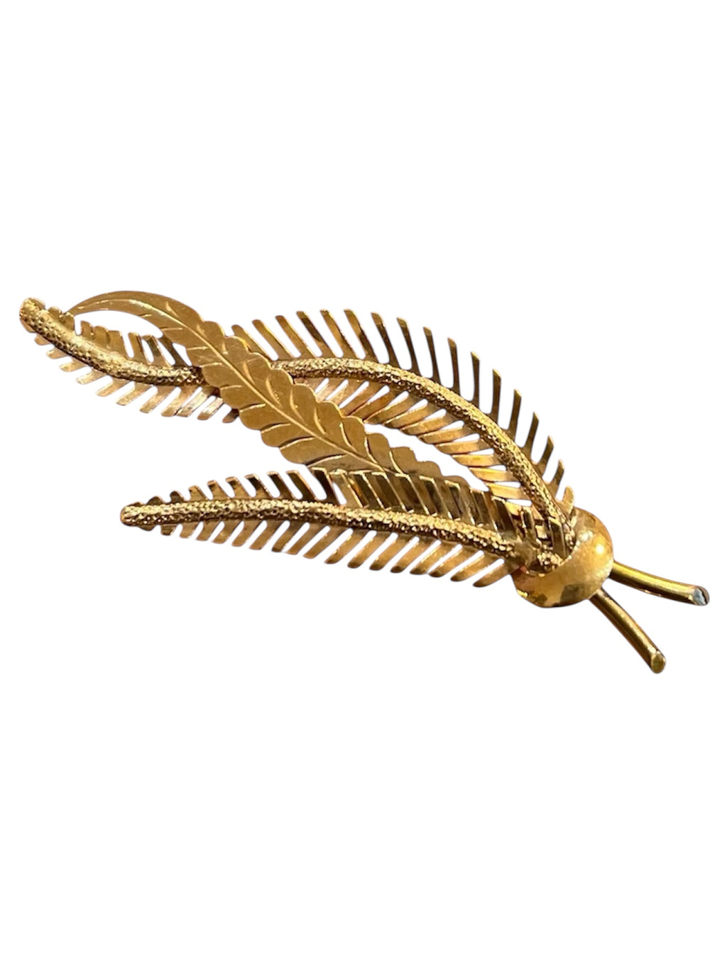 “Palm branch” brooch in 18K yellow gold, with chiseled and textured gold.